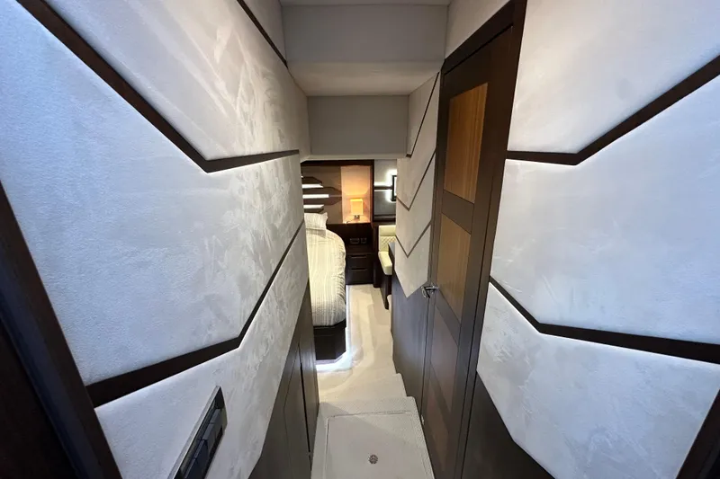 Slide: The Image of Luxurious interior hallway of 2017 Galeon 560 Sky yacht, featuring modern design elements. - 24