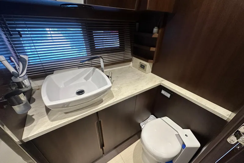 Slide: The Image of Luxurious bathroom in 2017 Galeon 560 Sky yacht with modern sink and toilet. - 32