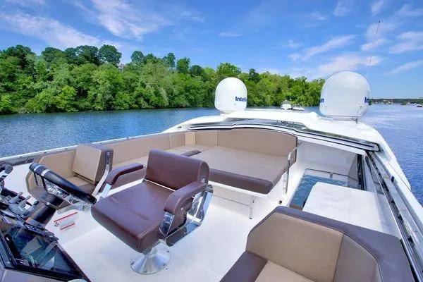 Slide: The Image of Luxurious 2017 Galeon 560 Sky yacht interior with plush seating on a serene waterway. - 36