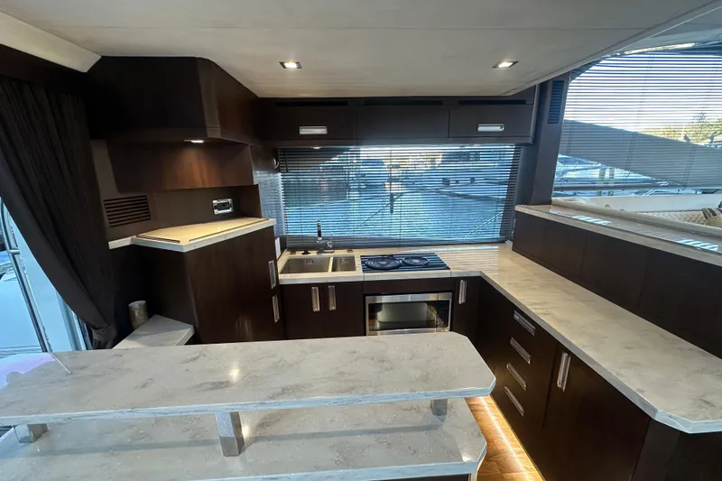 Slide: The Image of Luxurious kitchen interior of 2017 Galeon 560 Sky yacht with modern appliances and sleek design. - 4