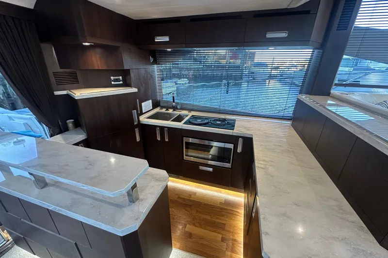 Slide: The Image of Luxurious kitchen interior of 2017 Galeon 560 Sky yacht with modern appliances and sleek design. - 6