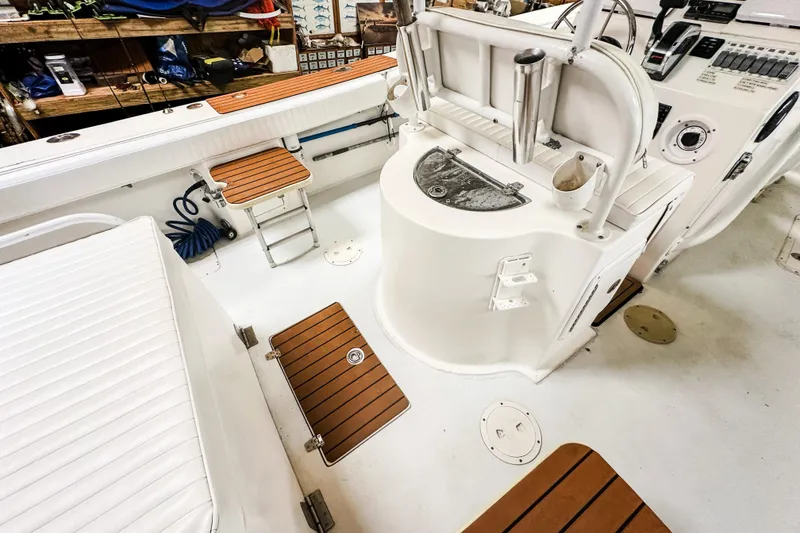 Slide: The Image of 2009 Blue Fin 240 Islander boat interior with seating and control panel. - 20
