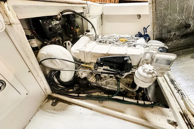 Slide: The Image of Engine compartment of 2009 Blue Fin 240 Islander boat, showcasing detailed mechanical components. - 27
