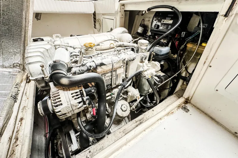Slide: The Image of Engine compartment of 2009 Blue Fin 240 Islander boat, showcasing detailed mechanical components. - 28