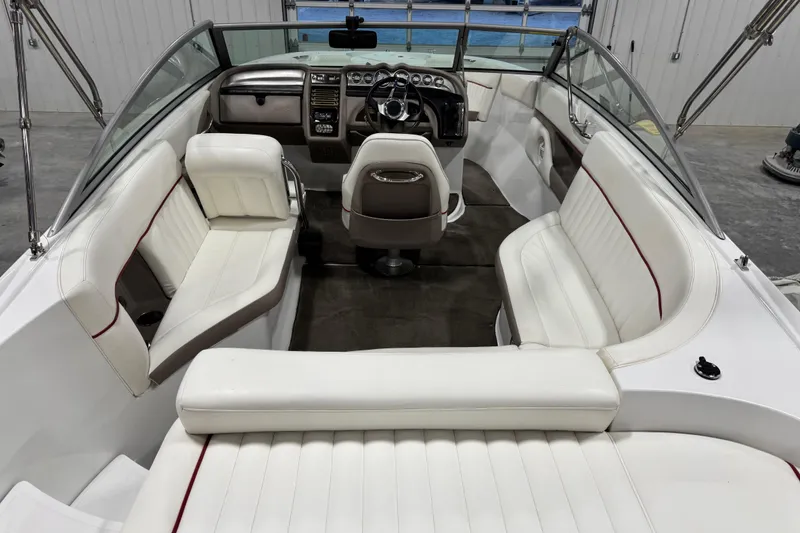 Slide: The Image of 2006 Cobalt 24SX boat interior with white seating and modern dashboard. - 14
