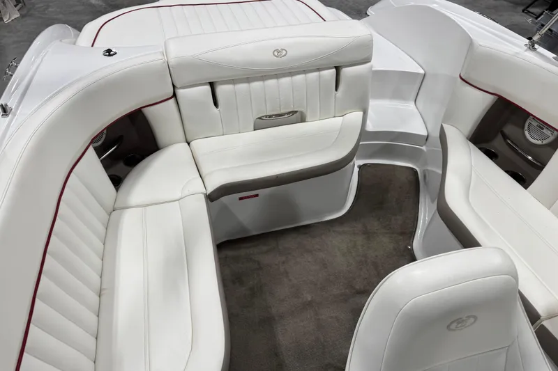 Slide: The Image of 2006 Cobalt 24SX boat interior with white leather seating and carpeted floor. - 8