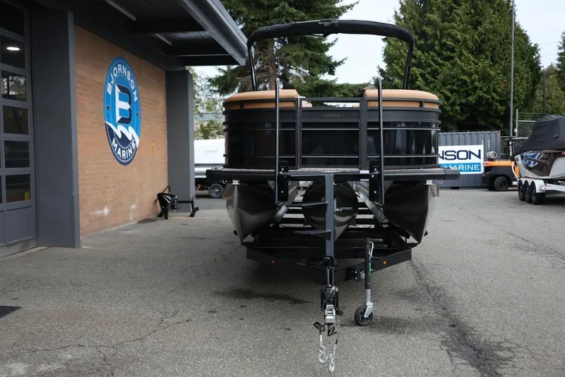Slide: The Image of 2026 Harris Solstice 250 SL pontoon boat on trailer at Bjornson Marine dealership. - 13