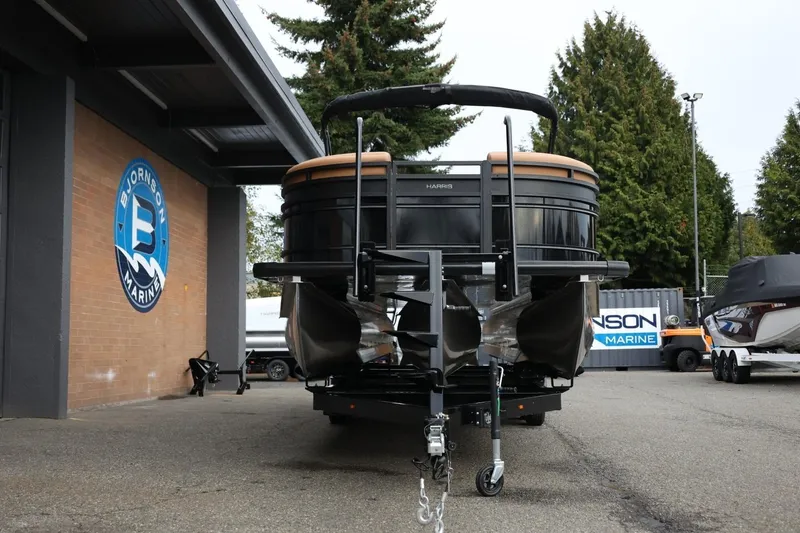 Slide: The Image of 2026 Harris Solstice 250 SL pontoon boat at Bjornson Marine dealership. - 14