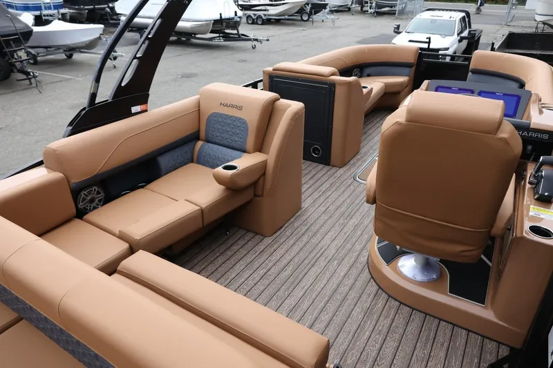 Slide: The Image of 2026 Harris Solstice 250 SL pontoon boat with luxurious tan seating and modern design. - 21
