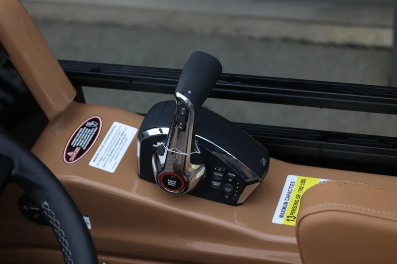 Slide: The Image of Throttle control of 2026 Harris Solstice 250 SL boat, featuring start/stop button and control panel. - 26