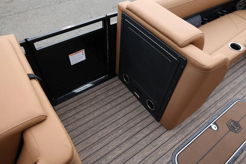 Slide: The Image of 2026 Harris Solstice 250 SL boat interior with tan seating and wood-style flooring. - 30