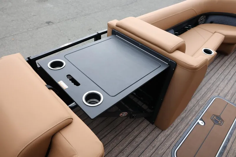 Slide: The Image of Luxury seating and table on 2026 Harris Solstice 250 SL boat, featuring cup holders. - 31