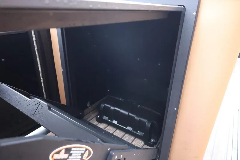 Slide: The Image of Storage compartment of 2026 Harris Solstice 250 SL boat, featuring sleek interior design. - 32