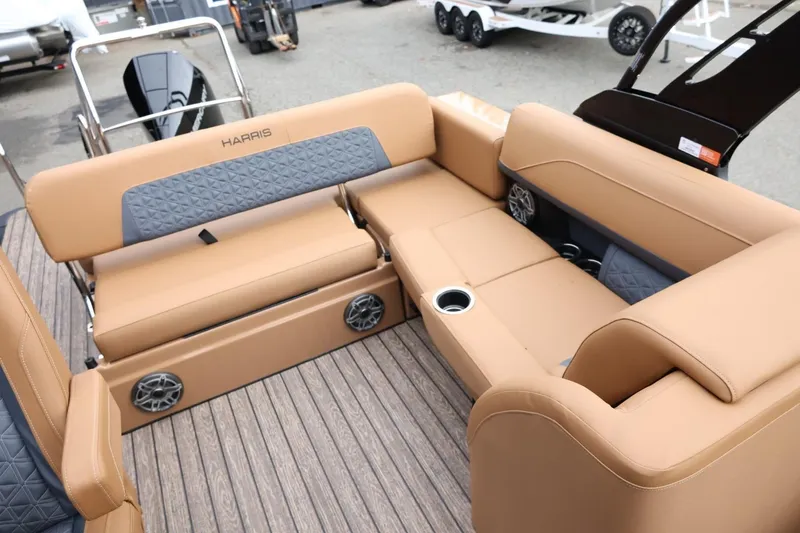 Slide: The Image of 2026 Harris Solstice 250 SL boat interior with tan seating and cup holders. - 42