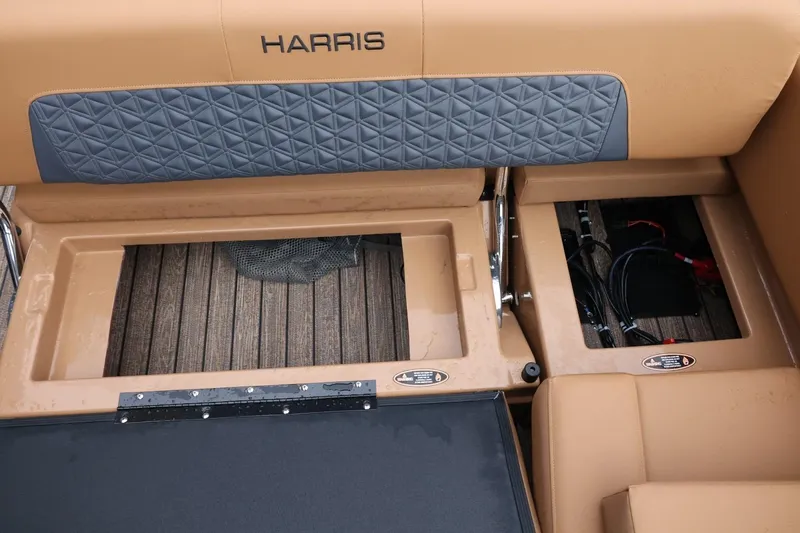 Slide: The Image of 2026 Harris Solstice 250 SL boat interior with storage compartments and quilted seating. - 45