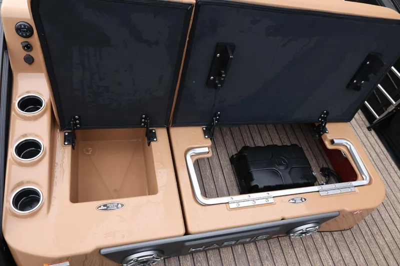 Slide: The Image of 2026 Harris Solstice 250 SL boat storage compartments with cup holders and equipment. - 46