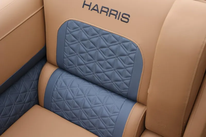 Slide: The Image of Luxurious tan and blue quilted seating in 2026 Harris Solstice 250 SL boat. - 47