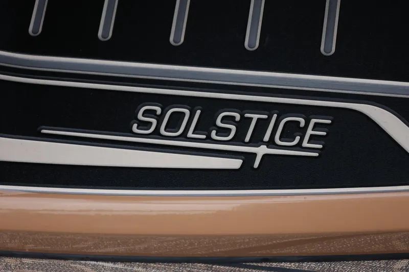 Slide: The Image of Close-up of 2026 Harris Solstice 250 SL logo on a sleek surface. - 50