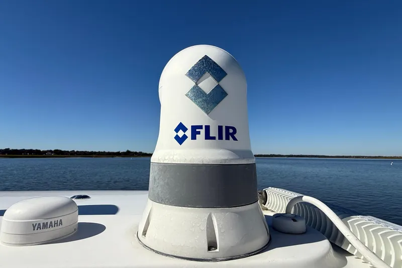 Slide: The Image of FLIR radar on 2022 Regulator 34 boat, with Yamaha equipment, against clear blue sky. - 13
