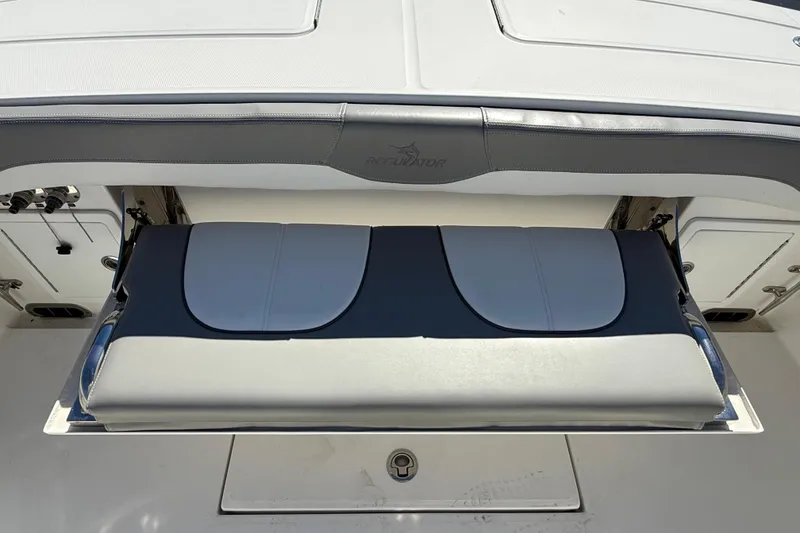 Slide: The Image of 2022 Regulator 34 boat with foldable seating and storage compartment. - 28