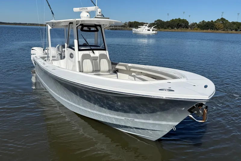 Slide: The Image of 2022 Regulator 34 boat on calm water with clear blue sky. - 4