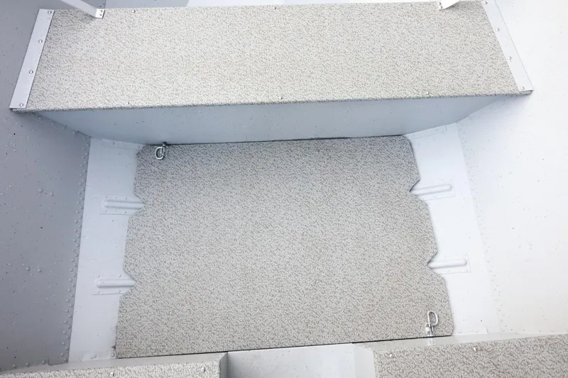 Slide: The Image of 2026 Lund SSV-16 Tiller boat interior with textured flooring and metal fixtures. - 20