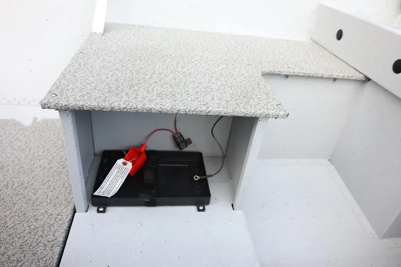 Slide: The Image of 2026 Lund SSV-16 Tiller boat interior with battery compartment and wiring. - 22