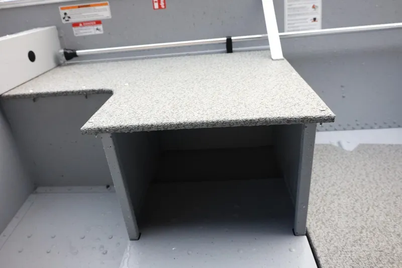 Slide: The Image of Interior view of 2026 Lund SSV-16 Tiller boat, featuring a storage compartment. - 23