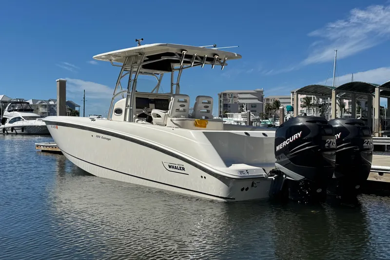 Slide: The Image of 2006 Boston Whaler 320 Outrage boat docked with twin Mercury engines. - 10