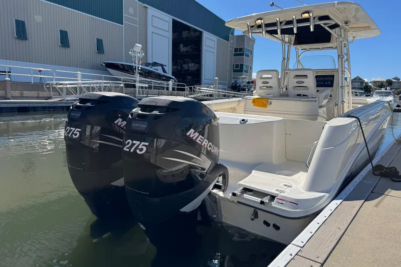 Slide: The Image of 2006 Boston Whaler 320 Outrage with twin Mercury 275 engines docked at marina. - 12