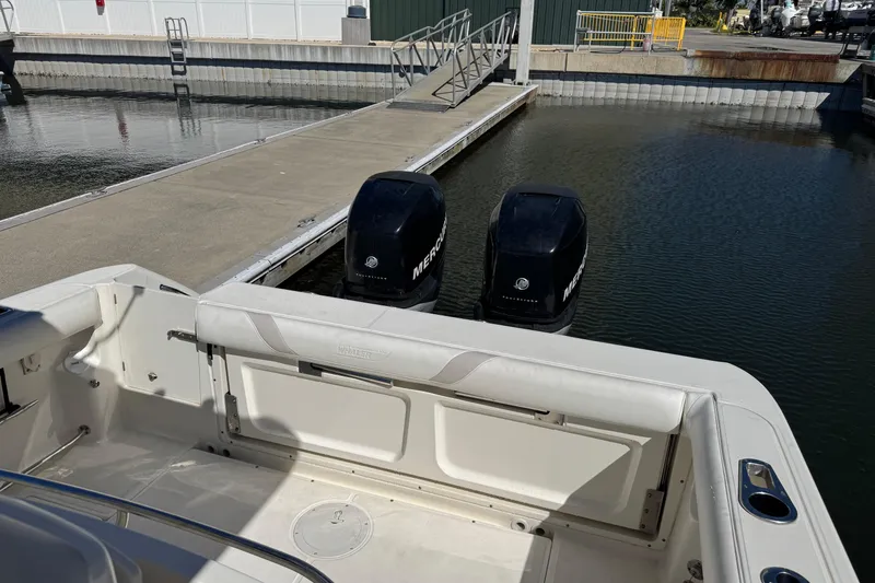 Slide: The Image of 2006 Boston Whaler 320 Outrage with twin Mercury engines docked at marina. - 14