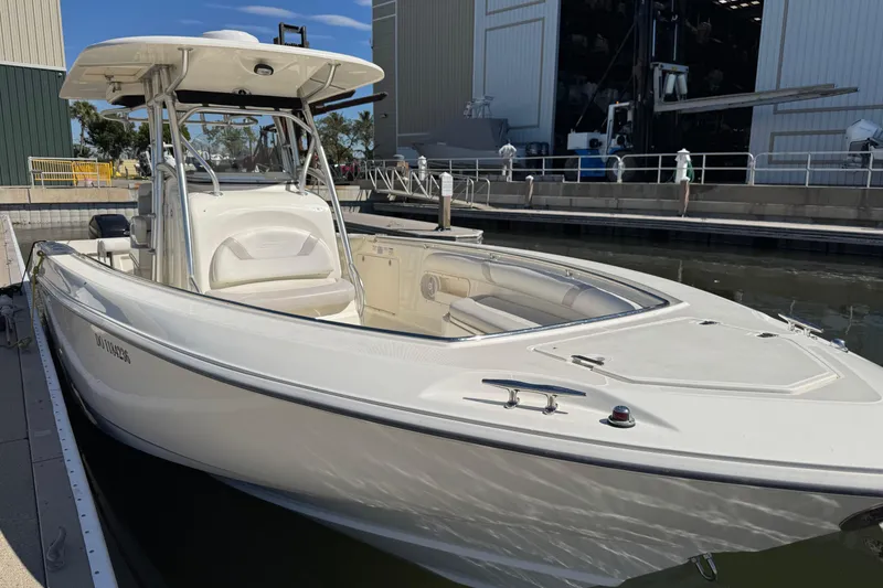 Slide: The Image of 2006 Boston Whaler 320 Outrage boat docked at marina, side view. - 23