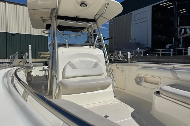 Slide: The Image of 2006 Boston Whaler 320 Outrage boat interior with seating and storage compartments. - 25