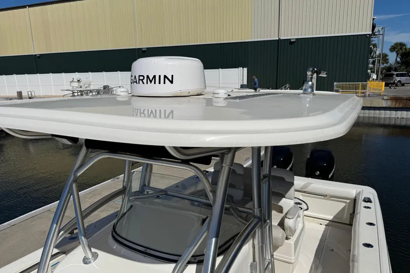 Slide: The Image of 2006 Boston Whaler 320 Outrage with Garmin radar, docked near industrial building. - 29