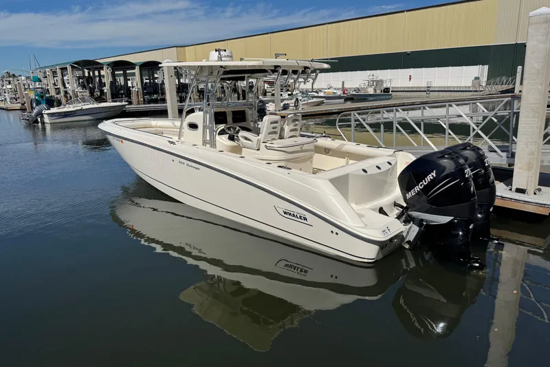 Slide: The Image of 2006 Boston Whaler 320 Outrage boat docked with twin Mercury engines. - 37