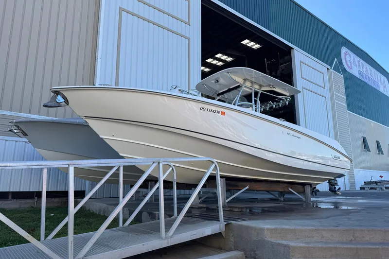 Slide: The Image of 2006 Boston Whaler 320 Outrage boat docked at marina entrance. - 4