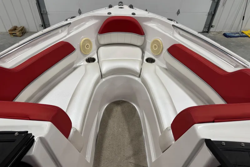 Slide: The Image of 2011 Four Winns 210 Horizon SS boat interior with red and white seating. - 9