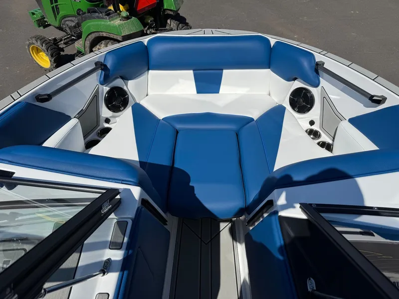 Slide: The Image of Interior of 2026 Moomba Mondo with blue and white seating. - 25