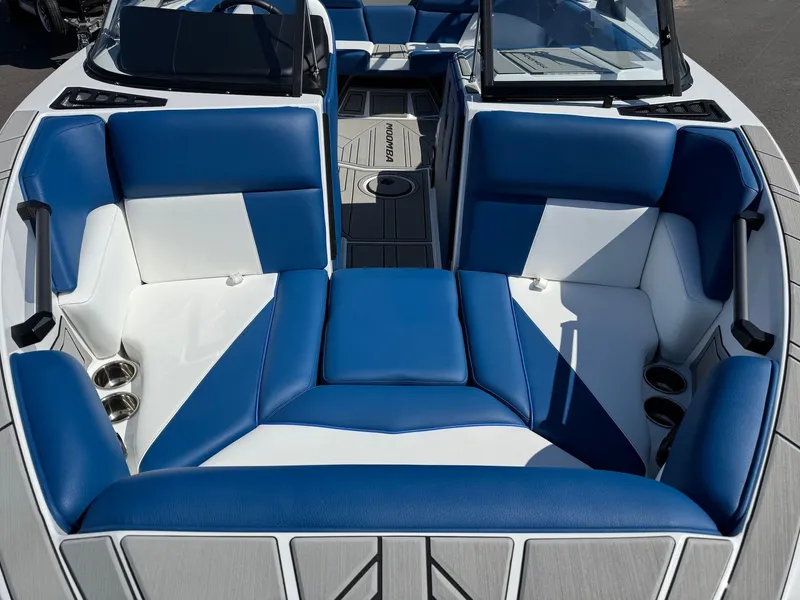 Slide: The Image of 2026 Moomba Mondo boat with blue and white seating. - 26