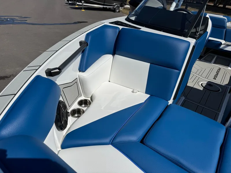 Slide: The Image of Interior of 2026 Moomba Mondo with blue and white seating. - 28