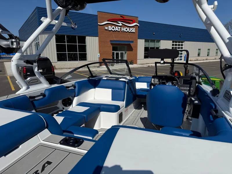 Slide: The Image of Interior of a 2026 Moomba Mondo boat outside a boathouse. - 31