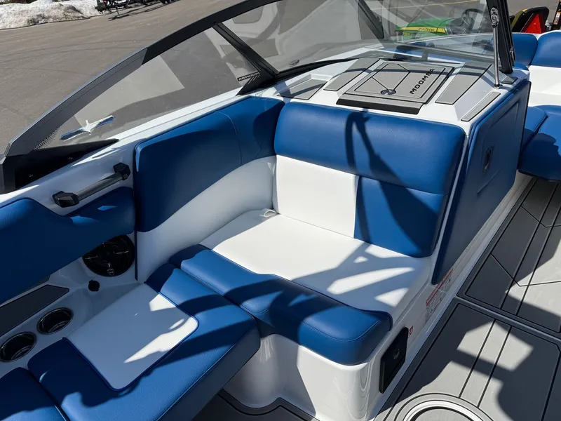 Slide: The Image of 2026 Moomba Mondo interior with blue and white seating. - 32