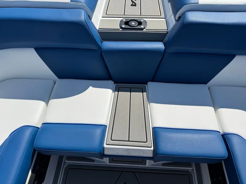 Slide: The Image of 2026 Moomba Mondo boat interior with blue and white seating. - 35