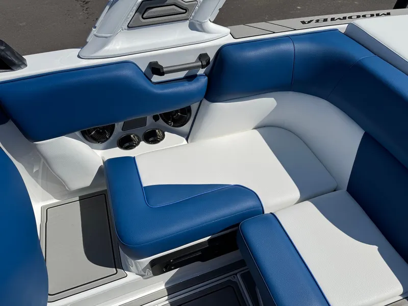 Slide: The Image of Interior of 2026 Moomba Mondo with blue and white seating. - 36