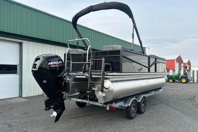 Slide: The Image of 2026 Lowe LS 210 WT pontoon boat with Mercury engine on trailer. - 13