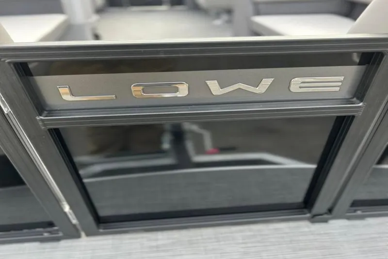 Slide: The Image of 2026 Lowe LS 210 WT boat with sleek metallic branding. - 18