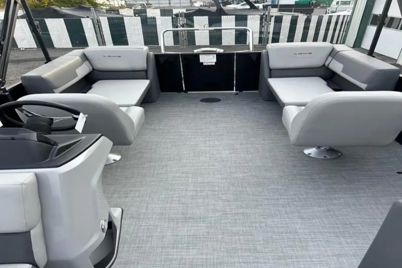 Slide: The Image of 2026 Lowe LS 210 WT boat interior with gray seating and modern design. - 22