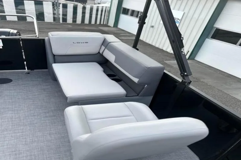 Slide: The Image of 2026 Lowe LS 210 WT boat interior with gray seating and modern design. - 27