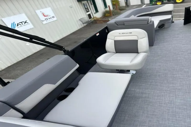 Slide: The Image of 2026 Lowe LS 210 WT boat interior with gray seating and modern design. - 30