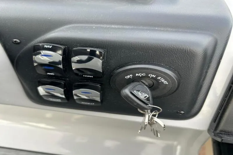 Slide: The Image of Control panel of 2026 Lowe LS 210 WT boat with ignition and switches. - 34